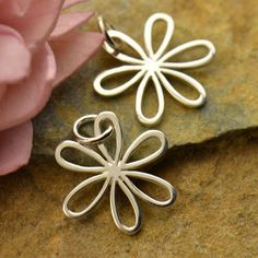 Daisy Charm in Sterling Silver. Medium Sterling Silver Daisy Charm with Open Petals. This daisy charm has open petals perfect for wire wrapping beads or connecting to more sterling silver charms. Cut off the jump ring and use this charm just like a jewelry link. Size: 19 mm x 14 mm Length measure includes 5 mm jump ring. Wire Wrapping Beads, Daisy Petals, Daisy Jewelry, Daisy Charm, Monogram Jewelry, Feather Charms, Flower Charm, Silver Flowers, Flower Jewellery