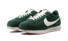 The Women’s Nike Cortez "Fir Green" is a women’s-exclusive colorway of the retro running and lifestyle shoe with a green-based look.  Said to be inspired by the seemingly never-ending forest of trees that surround Nike’s Oregon headquarters, the “Fir Green” Cortez has a green canvas base with green suede overlays.  An oversized white leather Swoosh appears on either side of the shoe.  A classic green “Nike” logo is matched with a green Swoosh on the white leather heel tab.  More “Nike” branding is found on the tongue.  Underfoot, a white foam midsole with grey accenting completes the look.  Release date: October 24, 2023 Urban Green Custom Sneakers With Gum Sole, Urban Style Green Custom Sneakers With Gum Sole, Nike Casual Custom Sneakers For Outdoor, Casual Green Running Shoes With Cushioned Footbed, Green Casual Custom Sneakers With Gum Sole, Casual Green Custom Sneakers With Gum Sole, Nike Green Retro Sneakers, Urban Green Sneakers With Rubber Waffle Outsoles, Retro Green Nike Sneakers