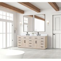 a large bathroom with double sinks and mirrors