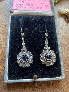 BEAUTIFUL Natural Blue Sapphire with Rose Cut Diamonds earrings 18K yellow/white gold from Italy COLLECTABLE & RARE  Medium Blue sapphires natural and genuine Faceted estimated.25ct. each = .50ct. total  bezel set and open backed  34 Old Rose cut diamonds  ( 17 in each ) surrounding and on top Primitive &crude old cut (not machine cut and few facets ) see photos estimated .02- .08ct. diamonds totally over 1 ct. - impossible to be accurate 100% with the diamond weight without removing the stones All stones appear original The earrings measure approx. 1 1/4" N to S with the wire , 5/8" E to W Weigh 5.4 grams 18k wire/ all stones and setting Silver  STUNNING & EXCELLENT condition! The Victorian era is generally agreed to stretch through the reign of Queen Victoria (1837-1901). It was a tremen Hallmarked Yellow Gold Sapphire Earrings, Hallmarked Sapphire Earrings In Yellow Gold, Yellow Gold Sapphire Earrings Hallmarked, Diamonds Earrings, Old Rose, Natural Blue Sapphire, Queen Victoria, Rose Cut Diamond, Antique Victorian