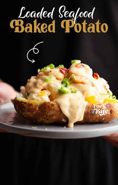 loaded seafood baked potato on a plate with the title above it reads loaded seafood baked potato