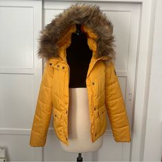 Noisy May Yellow Padded Parka With Faux Fur Hood. Nwt. Originally $60. It’s A Size M, But It Fits Me And I’m A Size S, So I’d Say It’s Somewhat Between Sizes. Message Me About Discounts For Multiple Items Or To Make An Offer. I’m A Fan Of Recycling, So The Item May Arrive In A Used Box From Another Company. Please Let Me Know If This Is An Issue. Yellow Winter Puffer Jacket, Fitted Yellow Hooded Outerwear, Red Puffer Jacket, Red Puffer, Fur Parka, Quilted Puffer Jacket, Fur Hood, Parka Jacket, Padded Jacket