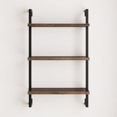 three wooden shelves with black metal brackets on the wall