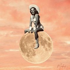 a woman sitting on top of a giant moon