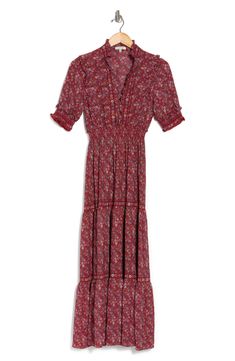 Add this smocked sleeve printed dress to your chic closet completing a stylish ensemble.Fit: this style fits true to size.- Split mock neck with ruffle detailing- Elbow length sleeves with smocked details- Smocked waist- Allover print- Tiered skirt- Maxi length- Approx. 53" length (size S)- Imported Machine wash cold 96% polyester, 4% spandex Casual Tiered Maxi Dress With Ditsy Floral Print, Spring Tiered Smock Maxi Dress, Casual Tiered Maxi Dress With Smocked Cuffs, Casual Tiered Midi Dress With Smocked Cuffs, Bohemian Tiered Dress With Smocked Cuffs, Smocked Sleeve, Chic Closet, Skirt Maxi, Tiered Maxi Dress