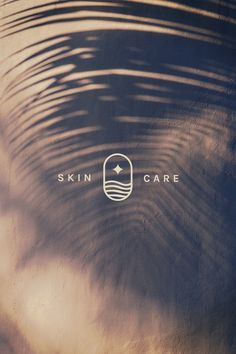 the skin care logo is reflected in the water's ripples on top of it