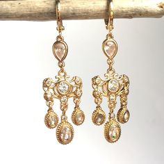 Cz Clear Glass Stones Are Securely Set In These Vintage Style Dangly Earrings. With A Sparkle At Every Turn, These Are Delicate And Showy At The Same Time. Excellent Quality 24k Gold Plated Charms & Huggie Ear Hooks, Clear Glass Stones Approx. Size: Overall 2" L, 1/2"W New Handmade, Nwt : Jpeace Designs Everyday, Gift, Trendy, Boho, Anthro, Mystic, Star, Dainty, Delicate Jewelry, Small Hoop, Hoops, Bridal, Bridesmaid, Vintage, Antique, Dressy, Formal, Crystal Jeweled Dangle Chandelier Earrings As Gift, Jeweled Dangle Chandelier Earrings, Jeweled Dangle Bridal Earrings, Jeweled Crystal Dangle Chandelier Earrings, Crystal Dangle Chandelier Earrings With Ear Wire, Crystal Chandelier Dangle Earrings, White Topaz Earrings, Wire Hoop Earrings, Witch Earrings