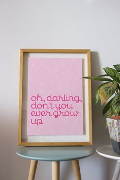 a pink framed print with the words, oh, dabbling, don't you ever grow up