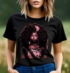 a woman wearing a black t - shirt with an afro girl on it