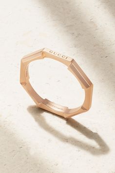 Gucci’s minimal yet sculptural ‘Link to Love’ ring is perfect for stacking with other styles from the same collection. Inspired by modern romance, it’s crafted from 18-karat rose gold that’s polished for a high shine and has a slender, octagonal design that’s engraved with the brand’s moniker on one edge. Gucci Designer Rings In 14k Gold, Gucci 14k Gold Designer Rings, Designer Gucci 14k Gold Rings, Gucci 14k Gold Rings For Formal Occasions, Gucci Gold 14k Gold Rings, Luxury Gucci 14k Gold Rings, Gucci 14k Gold Rings, Modern Rose Gold Rings For Everyday Luxury, Modern Rose Gold Rings For Everyday Wear