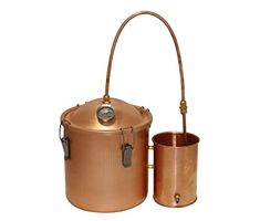 an old fashioned copper pot and bucket