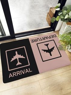 a door mat with an airplane and warning sign on it next to a potted plant