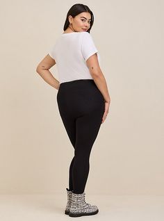 FIT Model is 5'10” wearing size 1. . 2” signature waistband. . 27” inseam. . MATERIALS + CARE Cotton blend fabric. 95% cotton, 5% spandex. . Machine wash cold. Tumble dry low. Imported. DETAILS Stirrup inset. Pocket detail. The best plus size women's full length signature waist stirrup pocket legging. skinny & tapered pants in black made of premium. Torrid is your destination for cozy fall and winter clothes to keep you warm and comfortable. Cotton Blend Fabric, Stirrups, Pocket Leggings, Tapered Pants, Winter Clothes, Bottom Clothes, Cozy Fall, Pocket Detail, Fall And Winter