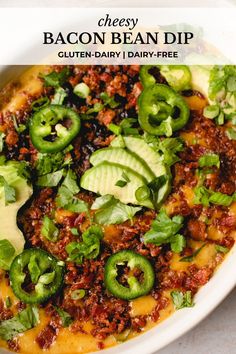 a white bowl filled with cheese and green peppers next to sliced avocado on top