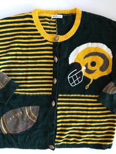 a black and yellow striped sweater with an image of a football helmet on the front