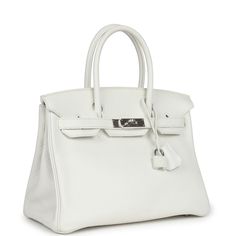 This Birkin is in White clemence leather with palladium hardware and has tonal stitching, a front toggle closure, a clochette with lock and two keys, and double rolled handles.The interior is lined with White chevre and has one zip pocket with an Hermes engraved zipper pull and an open pocket on the opposite side.Collection: TOrigin: FranceCondition: Pre-owned; Excellent to Mint - This bag retains its shape. There's no plastic on the hardware. There's visible scratching throughout to the hardwar Classic Togo Leather Bag With Silver-tone Hardware, Classic Formal Bags In Togo Leather, Birkin 30, Hermes Birkin 25, Hermes Birkin 30, Birkin 25, Hermes Birkin, Zip Pockets, Dust Bag