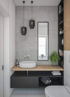 a bathroom with a sink, mirror and toilet in it's centerpieces