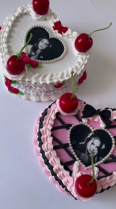 two heart shaped cakes with cherries on them