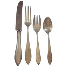 an assortment of silverware including forks, knives and spoons on a white background