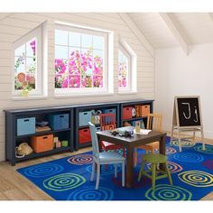 a child's playroom with colorful rugs and storage bins on the floor