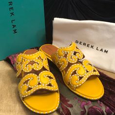 Brand New, Unworn Gorgeous Yellow Slip-On Sandal Mules From Luxury Designer Derek Lam. These Are Sold Out Everywhere And Very Rare. Features Gorgeous Deep Yellow Gold Leather With Swirl Cutouts And Prominent Contrast White Stitching. These Are Stunning And The Craftsmanship Is Exquisite. Comes With Original Box And Shoe Bag, Pictured. Gold Yellow Color, Rare Features, Deep Yellow, Embellished Sandals, Derek Lam, Gold Leather, Gold Yellow, Yellow Color, Luxury Designer