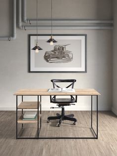 an office with a desk and chair in the corner, next to a framed drawing