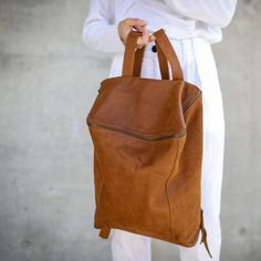 This luxurious Honey Brown nappa leather backpack is perfect for all your everyday needs. Made from genuine, soft leather, it has enough room for all your essentials, like laptops, IPADs, A4 files, books and even travel items. Its unique structured design has a zipper closure at at the top, and two sides zipper pockets for keys, and coins etc. It is fully lined with black strong cotton fabric which I divide to two large interior, zip pocket, and a leather cell phone pocket, shoulder strap is adj Work Backpack Women, Brown Leather Laptop Bag, Leather Bag Handmade, Handmade Leather Backpack, Women Backpack Travel, Leather Hip Bag, Large Leather Bag, Leather Laptop Backpack, Brown Leather Backpack