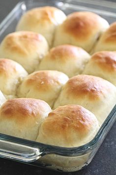 rolls in a glass baking dish ready to be baked