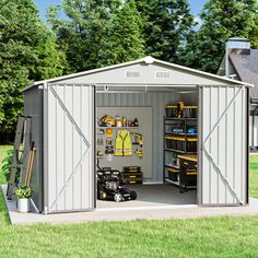 a storage shed with its doors open and tools in the garage area next to it