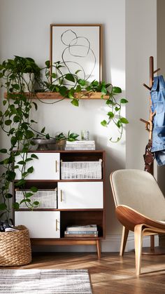 a living room filled with furniture and plants