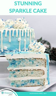 a blue cake with white frosting and sprinkles on top, sitting on a plate