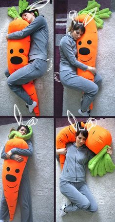 a person laying on the ground with a carrot pillow