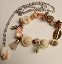 Seashell bracelet-N-necklace ensemble; seashells with mixed media editions on stretchy cord matching silver chain seashell necklace goes with it; this will add to any fun dress or casual outfit for women or girls! Casual Outfit For Women, N Necklace, Seashell Bracelet, Outfit For Women, Fun Dress, Seashell Necklace, Casual Outfit, Sea Shells, Favorite Jewelry