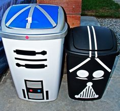 two trash cans with faces painted on them