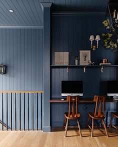 two computer desks sitting next to each other on top of a hard wood floor