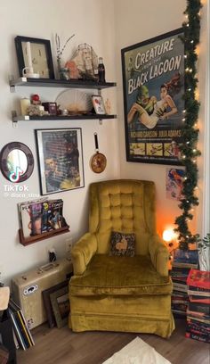 a living room filled with furniture and pictures on the wall next to a christmas tree