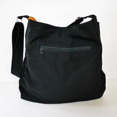 This versatile bag is made from 100% cotton canvas in black color, a sturdy and durable material. Its weight is about 380 grams. It's roomy enough to hold lots of your essentials. You can use it as an everyday bag, a travel bag, a messenger bag or a diaper bag.** You may request the following alterations at no additional cost:- the exterior and/or interior colors- the size in any dimension- the length of the adjustable strap- your choice of snap or zipper closureIf there is some other customizat Interior Colors, Canvas Messenger Bag, Everyday Bag, Black Canvas, Bag For Women, Canvas Bag, Tote Handbags, Travel Bag, Diaper Bag