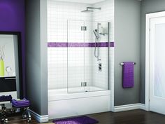 a bathroom with a purple rug on the floor and a walk in shower next to it