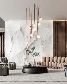 a living room filled with furniture and a chandelier hanging over the top of it