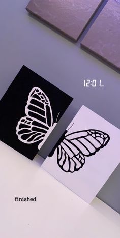 three different types of butterfly cards on a table