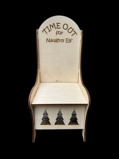 a wooden chair with three small trees on it's back and the words time out for naugry ef