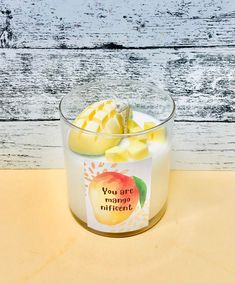 a glass container filled with yellow and white fruit