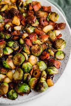 brussel sprouts and bacon on a white plate