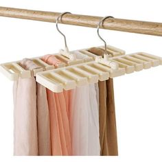 an over the door hanging rack with clothes on it