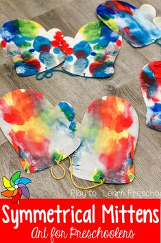 colorful paper heart shaped mitts with text overlay that says, symmetrical mittens art for preschoolers