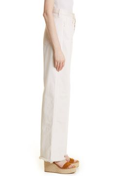 Flaunt a flattering retro vibe in these nonstretch jeans styled with a high waist and dramatic wide legs with frayed hems. 32" inseam, 22 1/2" leg opening; 13" front rise; 16" back rise (size 29) Button fly 100% cotton Machine wash, line dry Imported Classic Cream Wide Leg Jeans, High Rise Beige Cotton Wide Leg Pants, Beige High Rise Wide Leg Cotton Pants, Spring Off White Cotton Wide Leg Pants, Off White Cotton Wide Leg Pants For Spring, Chic Standard Cut Leg Cotton Pants, Beige Wide Leg Flare Jeans For Work, Chic Standard Cut Cotton Pants, Chic Off White Cotton Wide Leg Pants