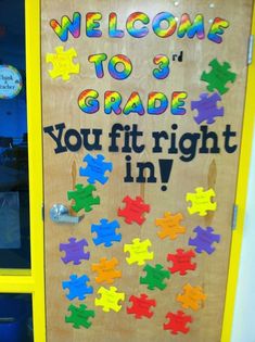 a door with puzzle pieces on it that says, welcome to 3rd grade you fit right in