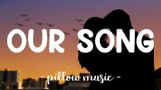 the silhouette of a couple kissing in front of a cityscape that says our song pillow music