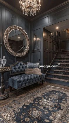 a living room with a couch, mirror and chandelier