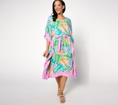 Look resort-ready in this flowing caftan. You'll be the belle of the beach when you show up in this tropical-printed cover-up. Pair it with some strappy sandals for a dockside dinner. From Denim & Co.® Fashions. Tropical Printed Cover-up For Resort Season, Tropical Print Swimwear For Vacation, Tropical Print Swimwear For Day Out, Tropical Swimwear With Tropical Print For Day Out, Flowy Beach Dress For Loungewear, Printed Flowy Beach Dress For Vacation, Flowy Printed Beach Dress For Vacation, Tropical Print Beach Dress For Resort Season, Tropical Style Cover-up For Summer Vacation